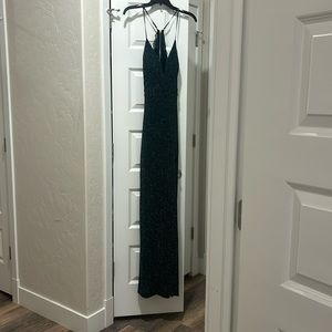 It’s a beautiful dark green sparkly dress